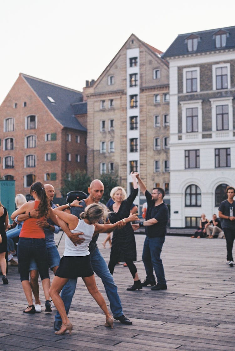 A Couples Dancing On The Street