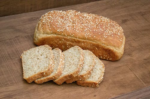 Free Bread on a Wooden Surface  Stock Photo