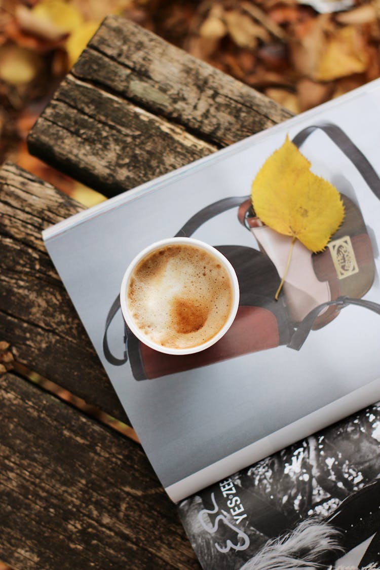 Coffee And Autumn Leaf On Magazine