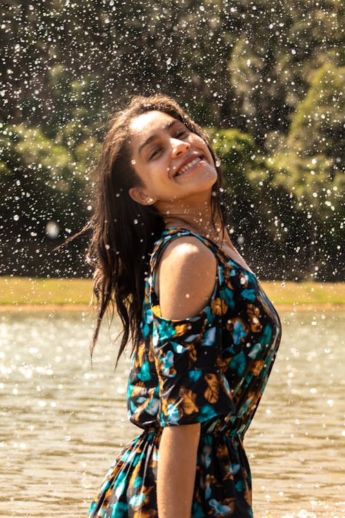 Woman in Printed Dress Looking Over Her Shoulder