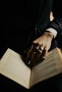 Hand of Magician on Book