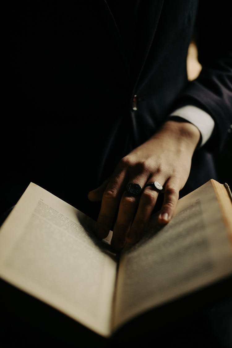 Hand Of Magician On Book