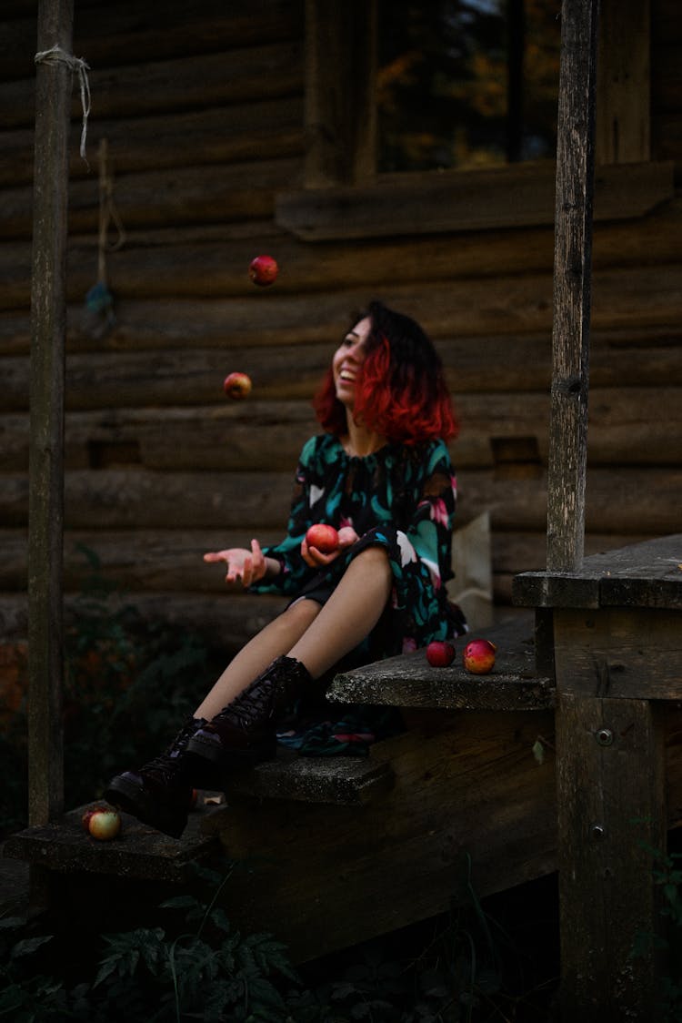 Smiling Girl Sitting On Steps 