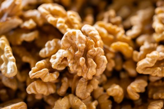 Detailed macro shot of fresh, organic walnuts with textured shells, perfect for food blogs.