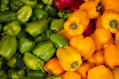 Free A close-up view of fresh, organic bell peppers in assorted colors, showcasing their vibrant hues. Stock Photo