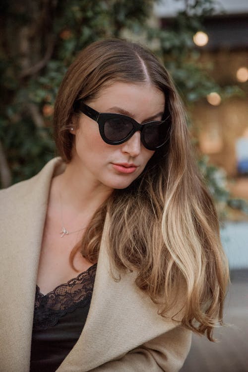 Woman in Black Sunglasses and Brown Coat