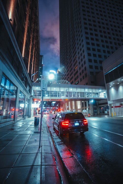 Cars Parked on Street Near High Rise Building · Free Stock Photo