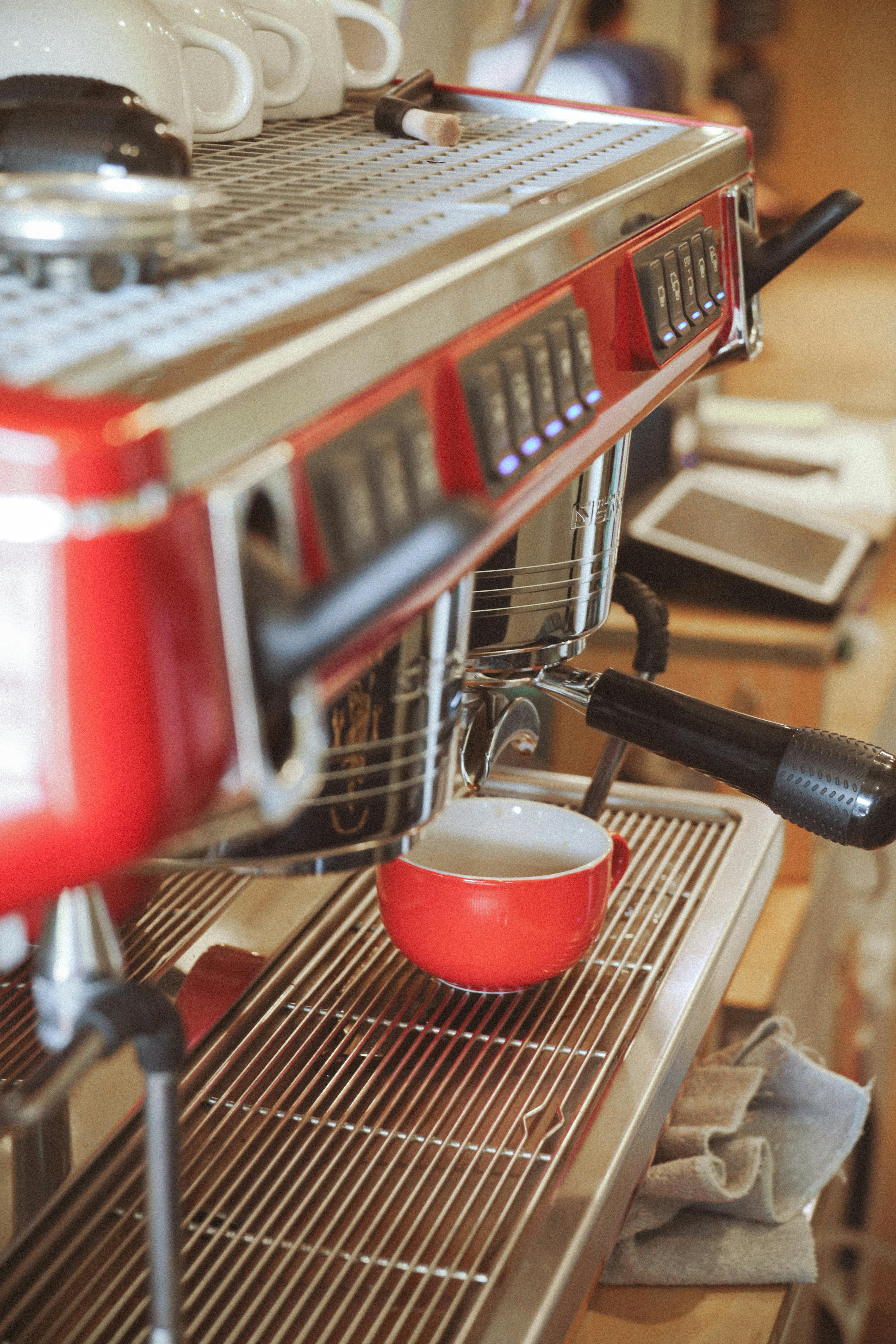 red and silver espresso machine