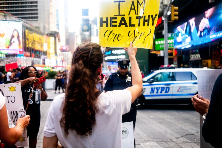 A Woman Holding A Sign