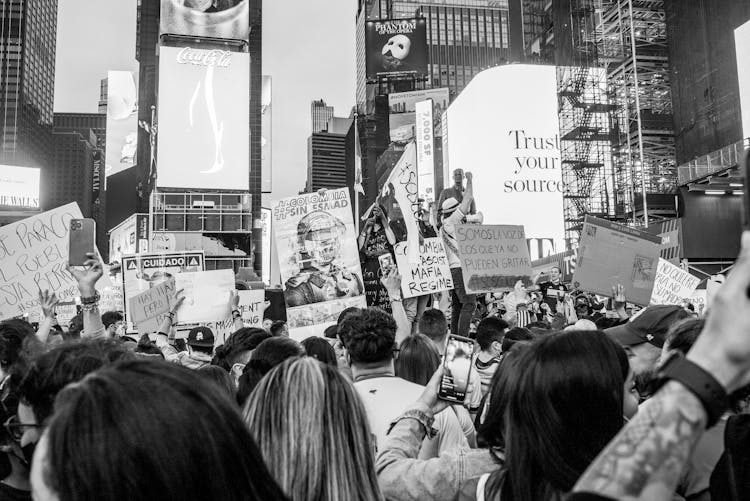 A Grayscale Of People Protesting