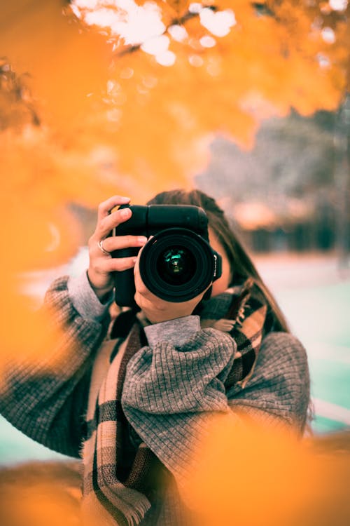 Woman Taking Photo with a Camera