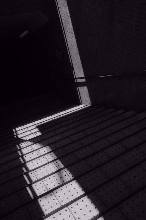 Grayscale Photo of Concrete Stairs