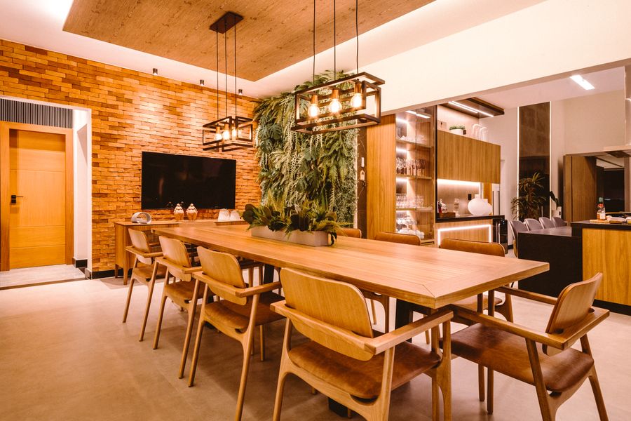 Dining room with a cluster of pendants and greenery, photo by Jonathan Borba on Pexels