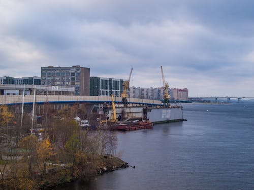 Waterfront with Cranes and Overcast