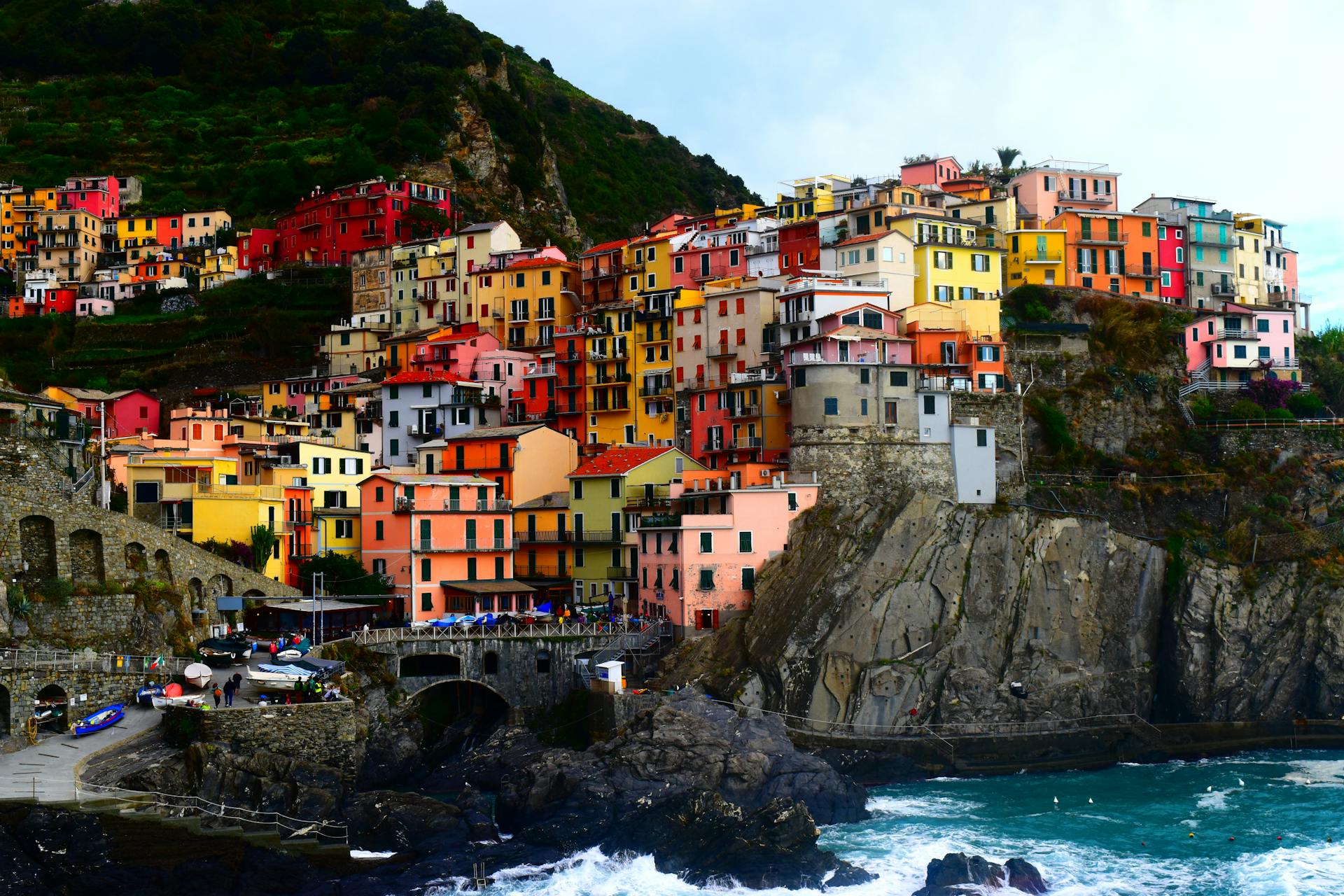 Explore the vibrant colors and stunning seaside cliffs of Cinque Terre's iconic village in Italy's Liguria region.