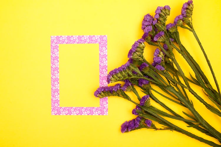 Frame Against Yellow Background With Flowers