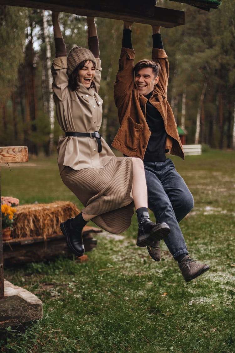 Man And Woman Hanging From Roof