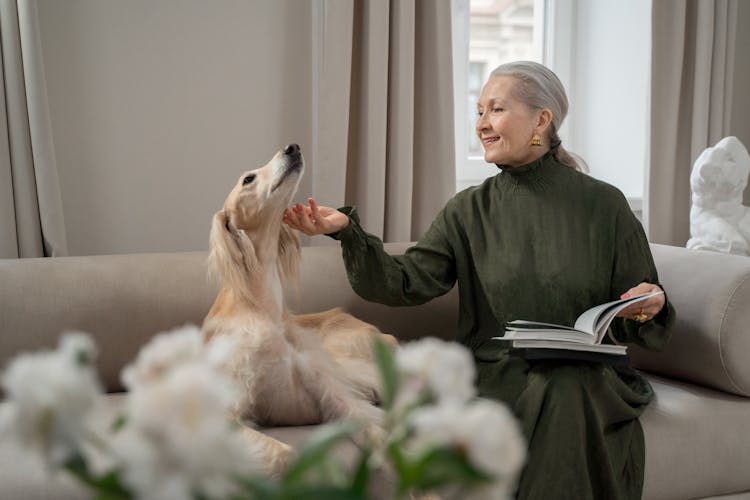 Elderly Woman Scratching Her Dog Chin