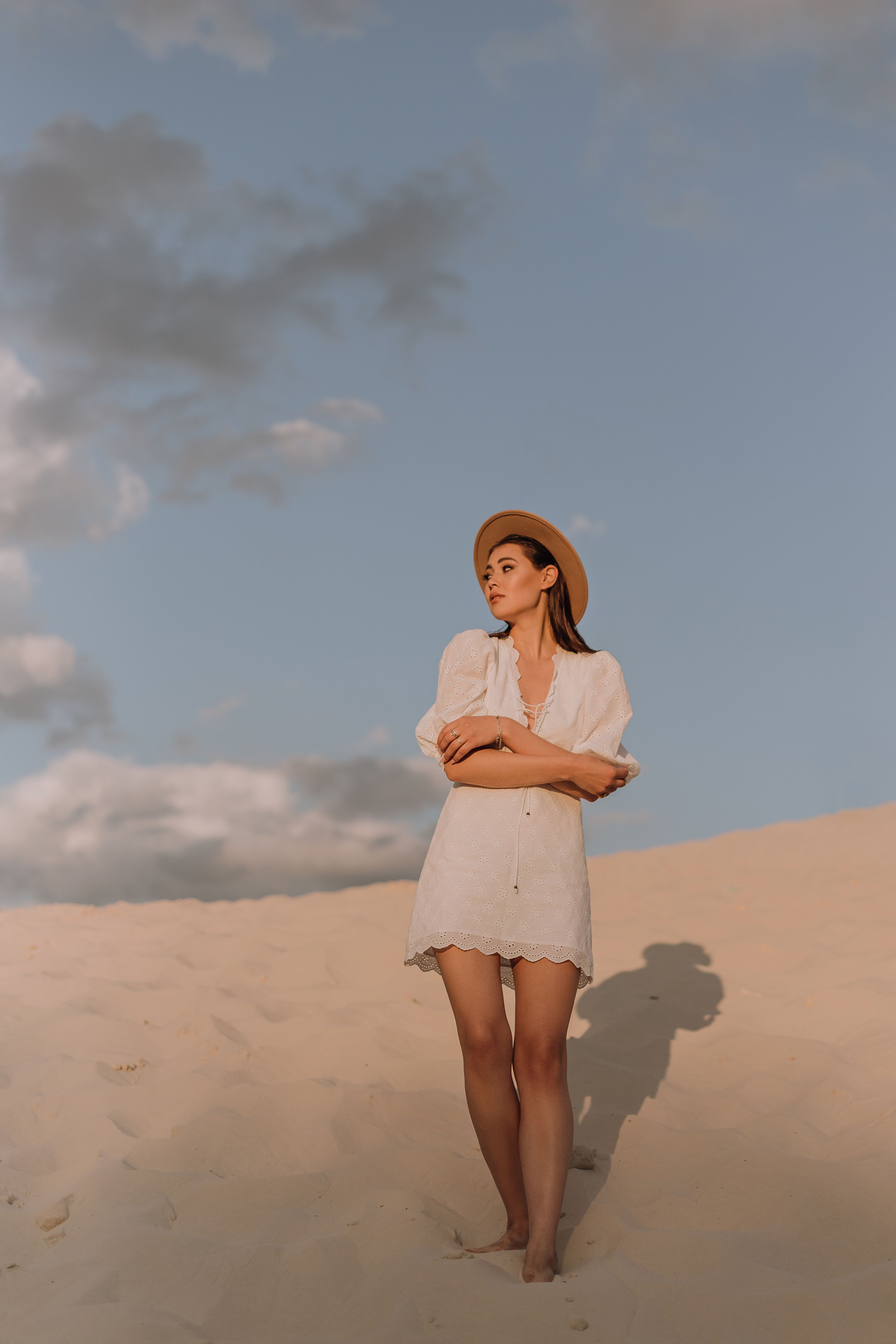 Woman in White Dress and Hat Standing in Desert · Free Stock Photo