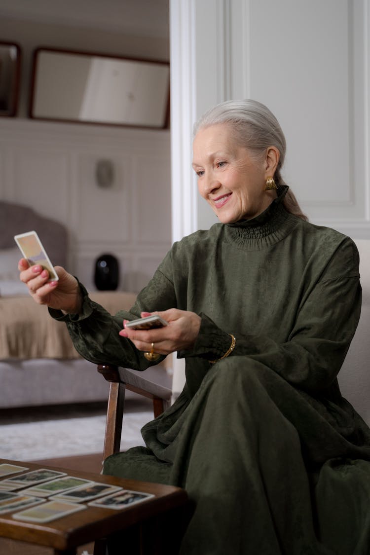 Senior Woman Enjoying Playing Cards At Home