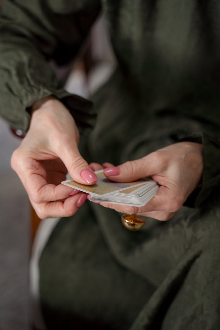 Unrecognizable Female Hands Holding Cards