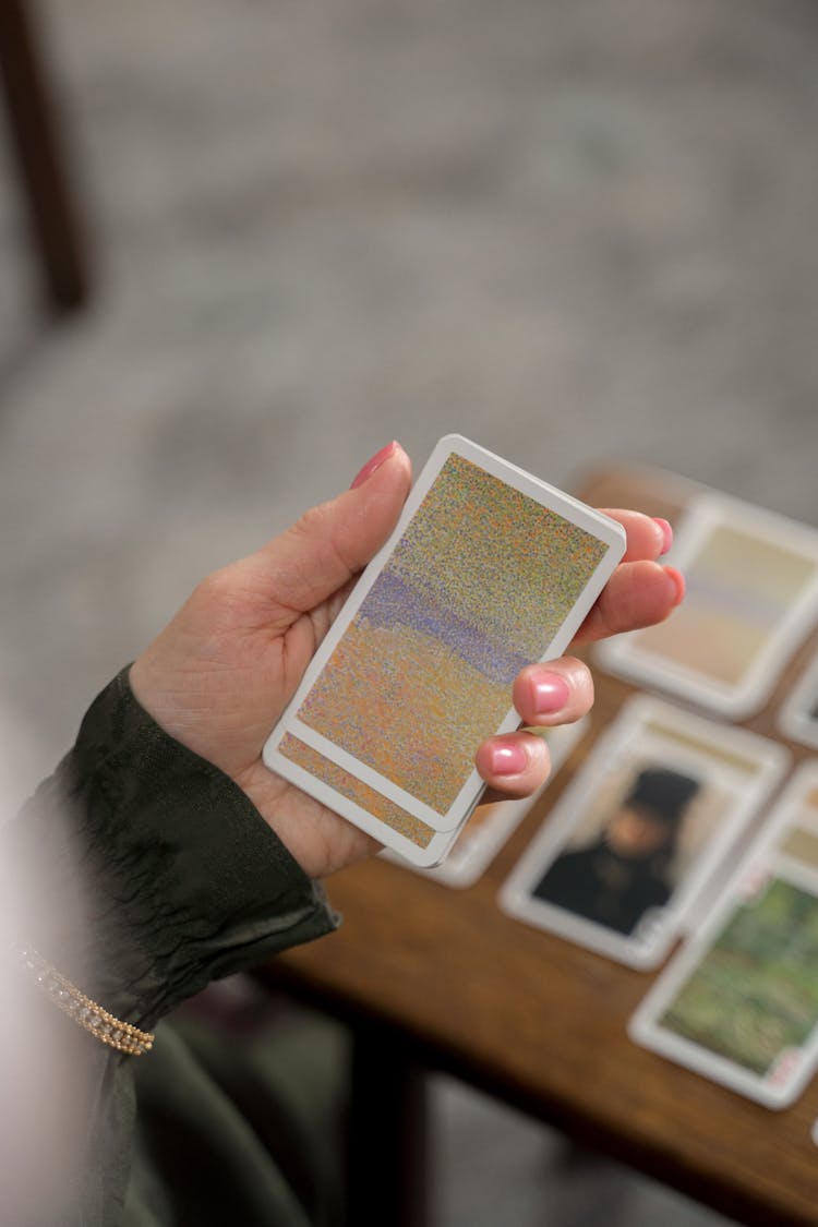 Unrecognizable Female Hand Playing Cards