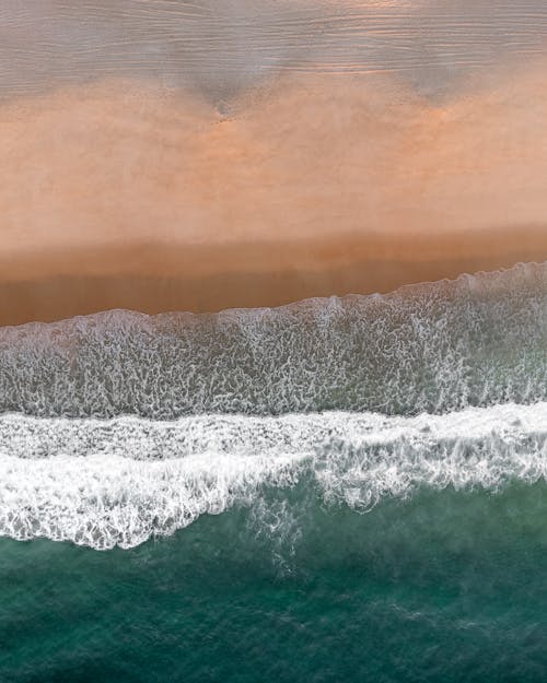 Aerial View of Sea Waves and Beach 