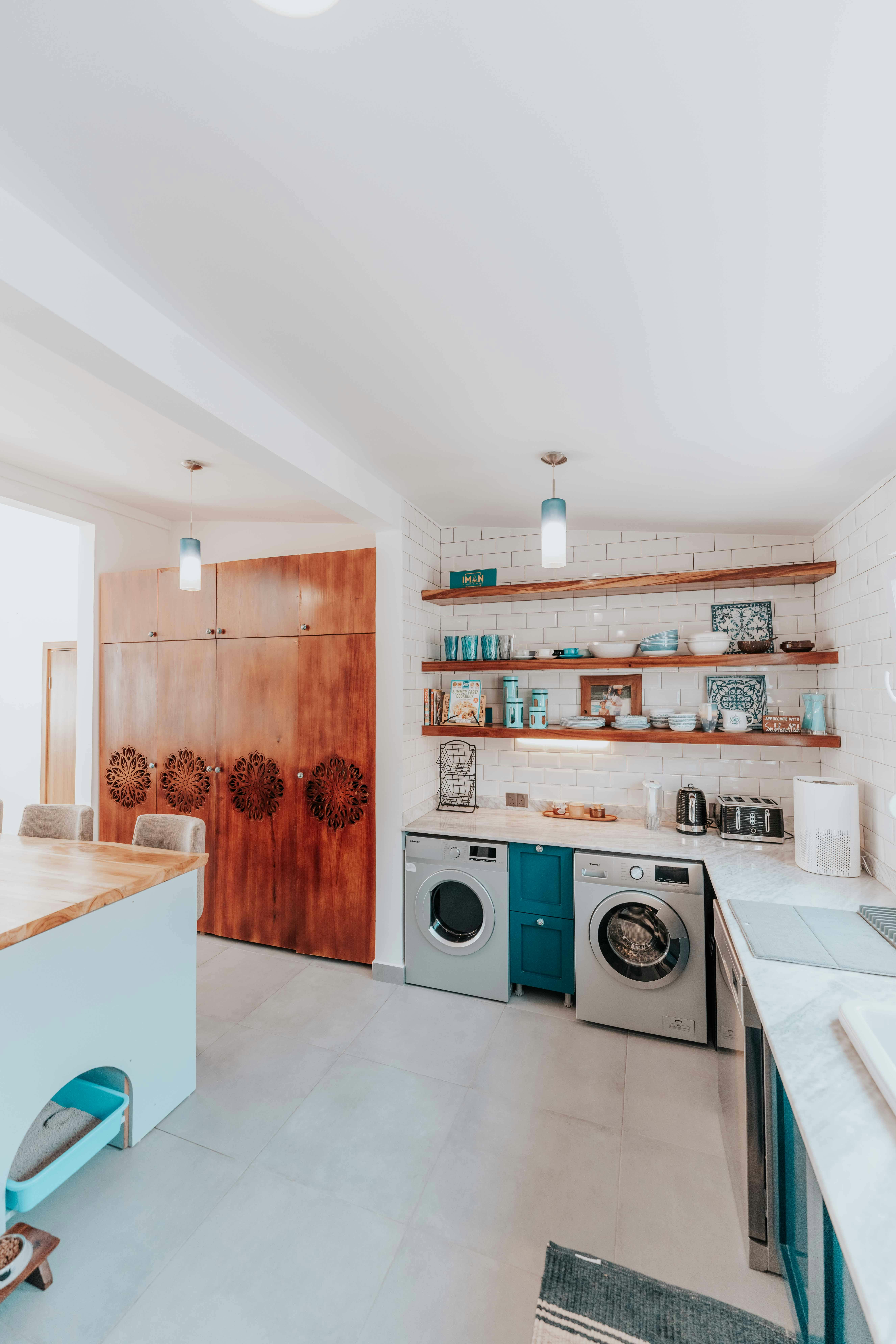 Bright and spacious modern kitchen featuring Scandinavian design elements with wooden and white accents.