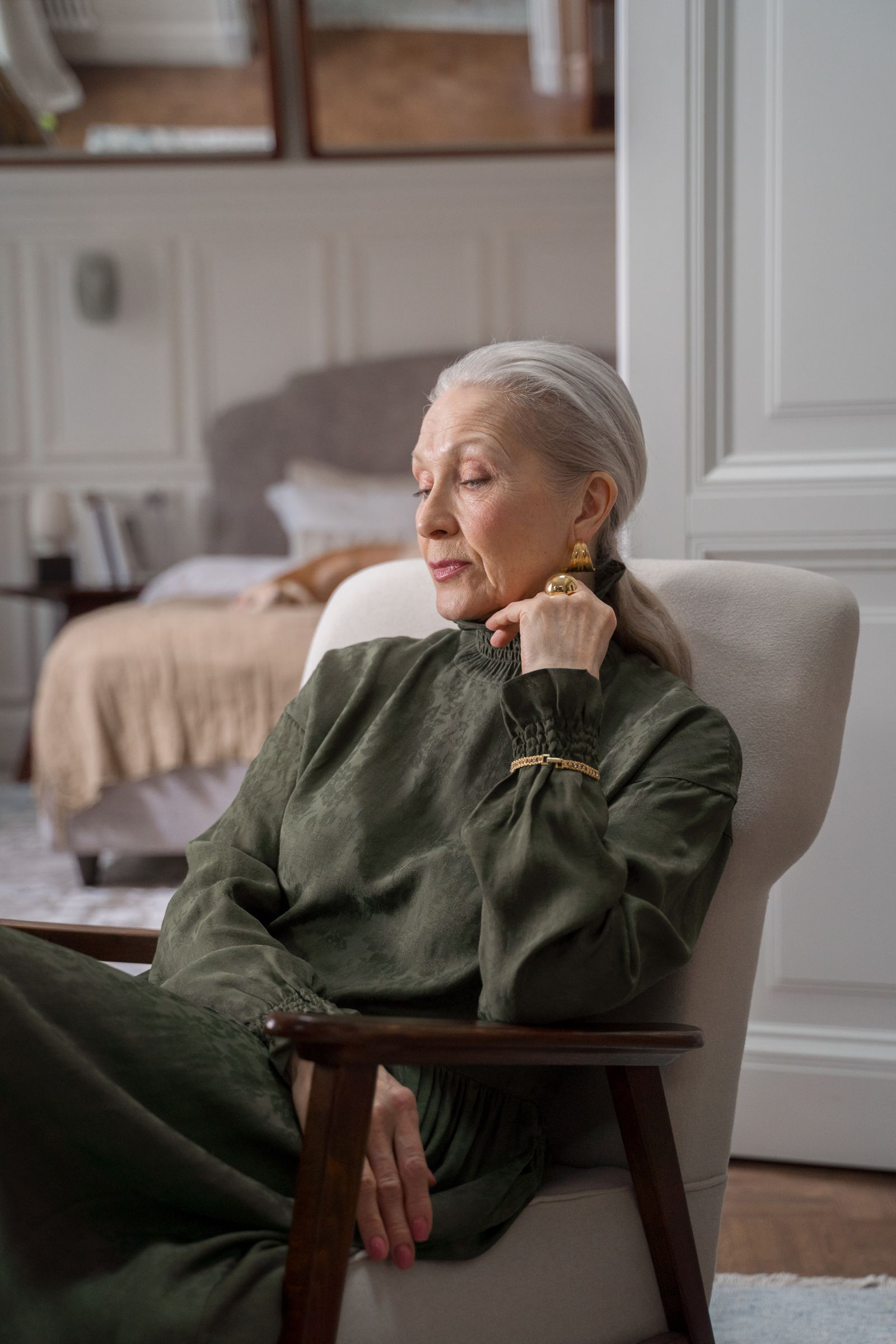 Senior woman sitting in an armchair