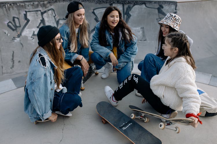 Friends Hanging Out At The Skatepark