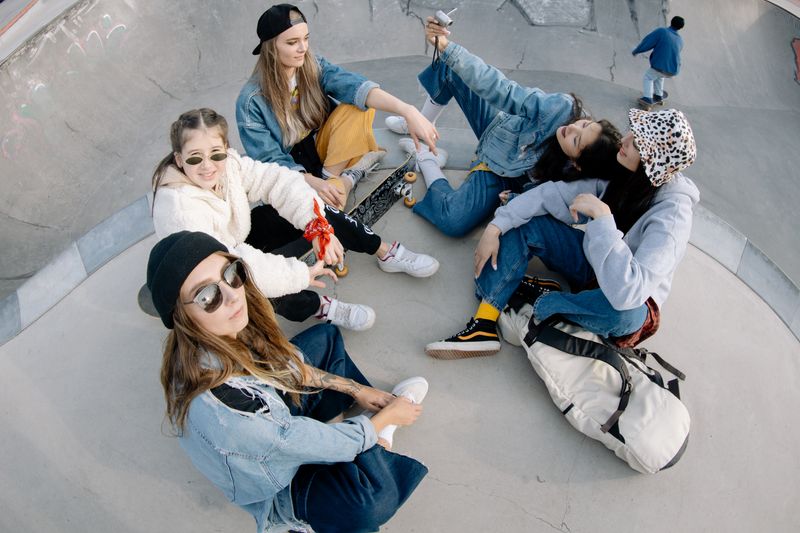 Group of friends having fun at a skate park