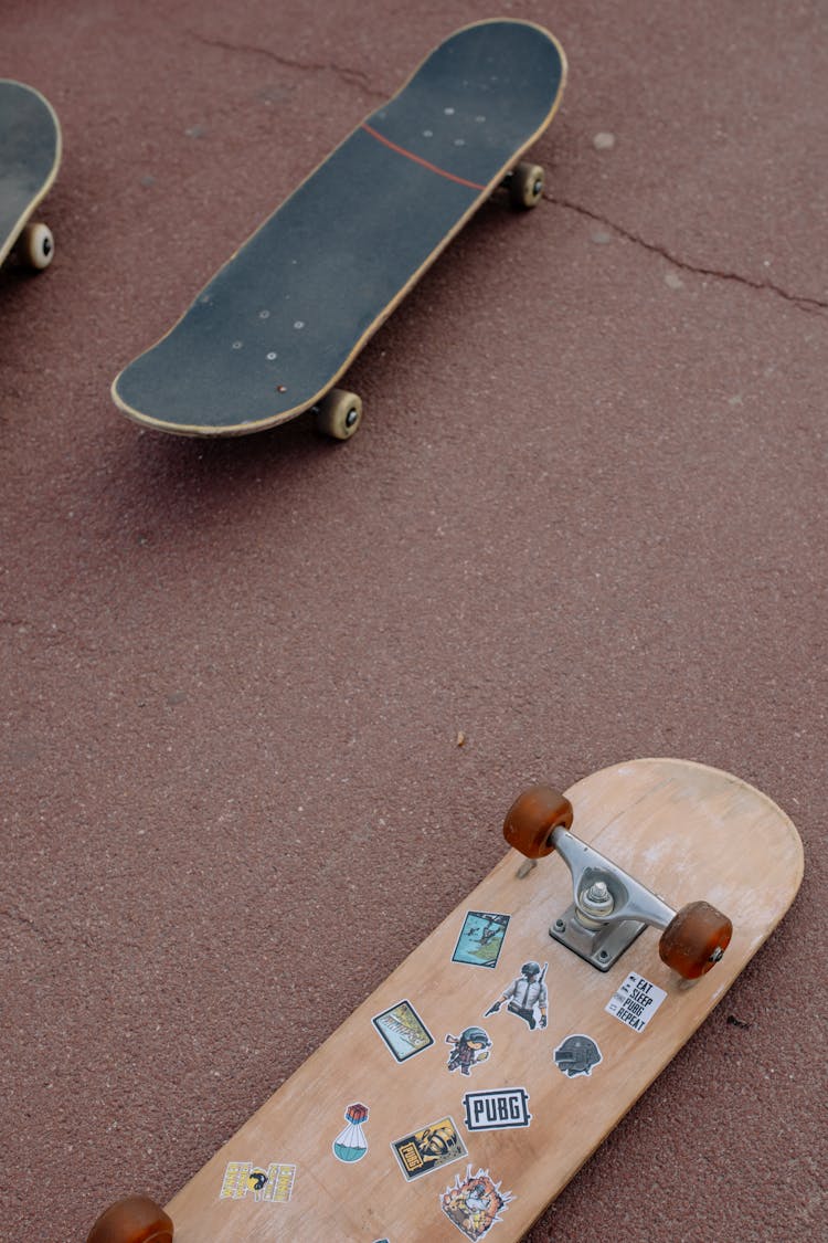 Skateboards Lying On Pavement