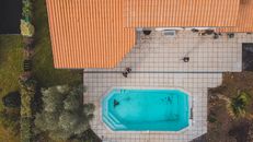 Modern house with swimming pool captured from above in Bordeaux, France.