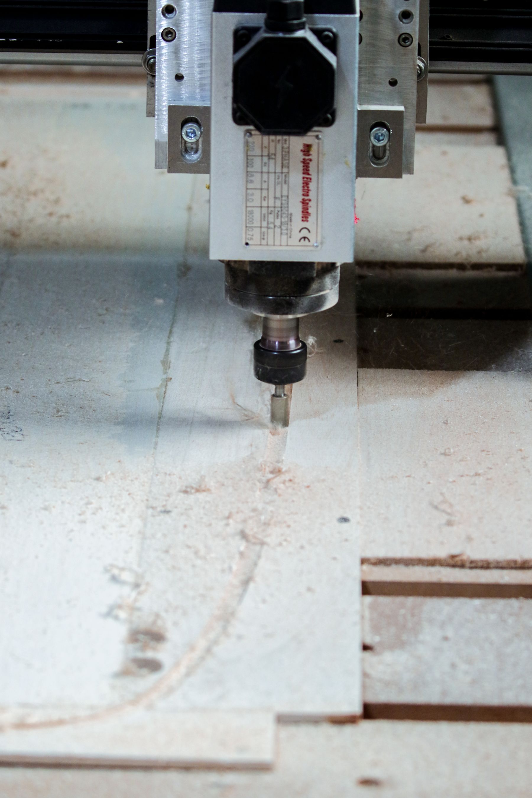 CNC machine cutting a wooden workpiece