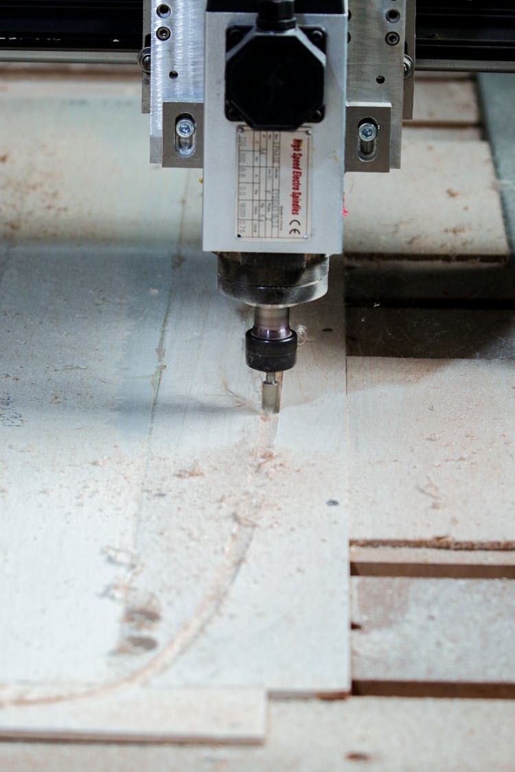 Lathe Cutting A Piece Of Wood Board