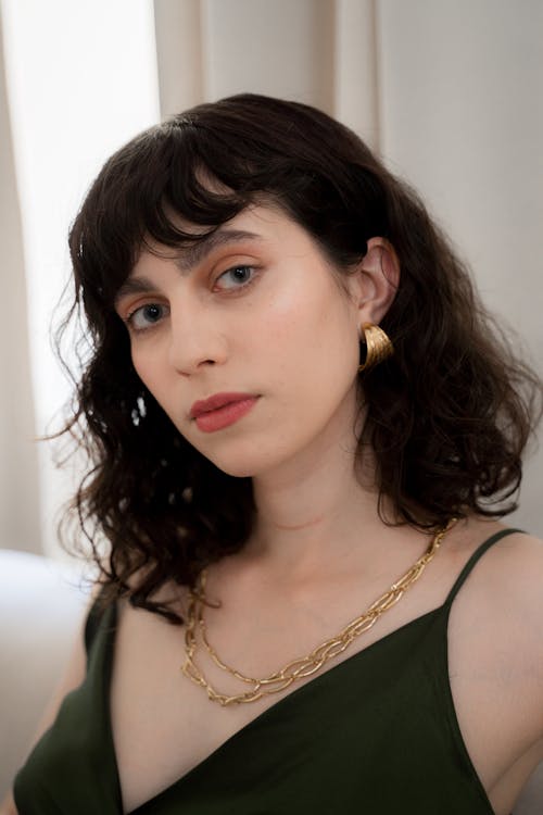 Portrait of Woman with Golden Earring and Necklace