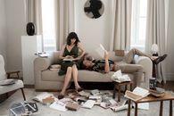 Man and Woman on Bed with Books around