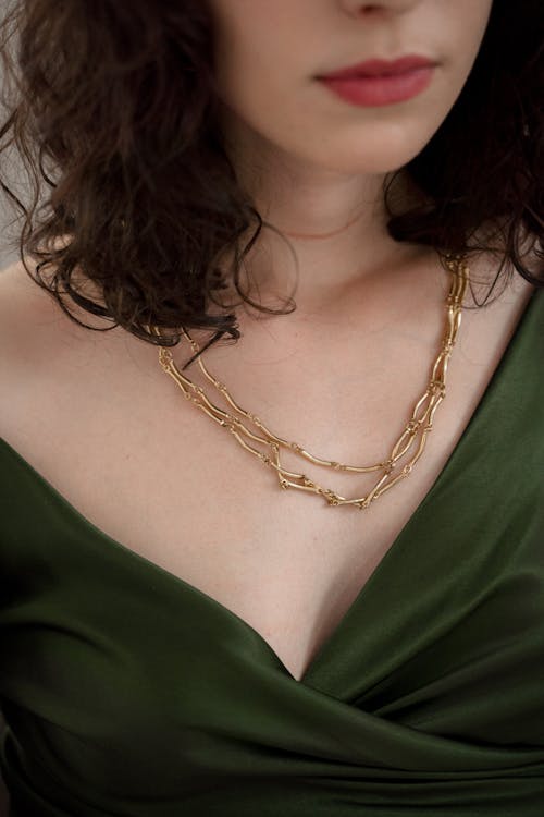 Close up on Golden Necklace on Womans Neck