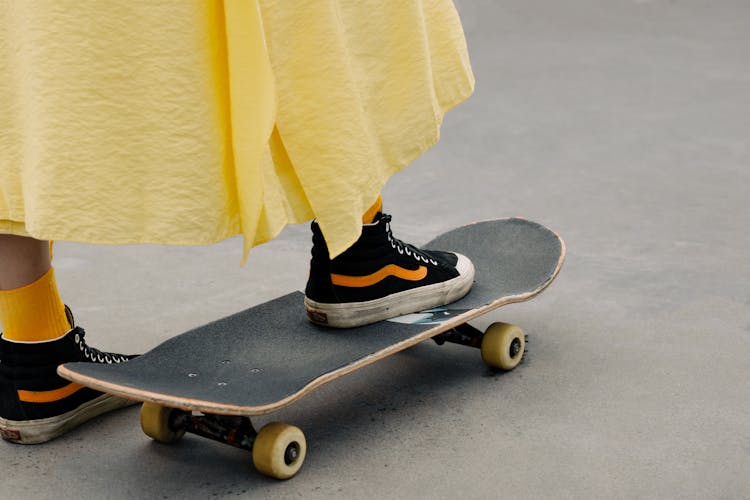 A Person Stepping On The Skateboard