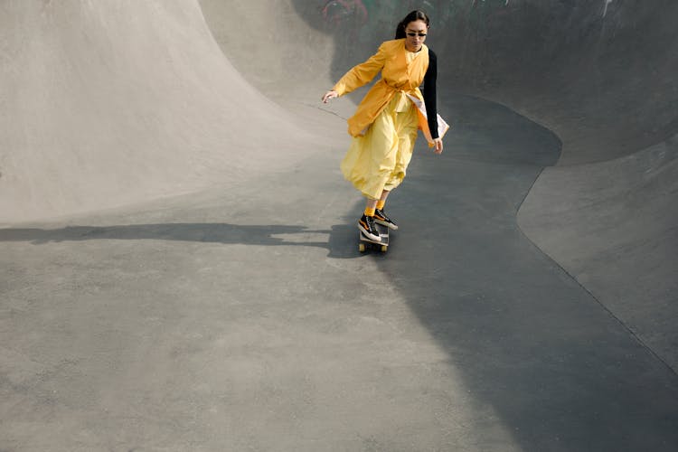 A Woman Riding A Skateboard