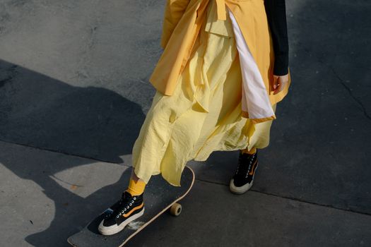 Woman in Yellow Dress and Black Leather Boots