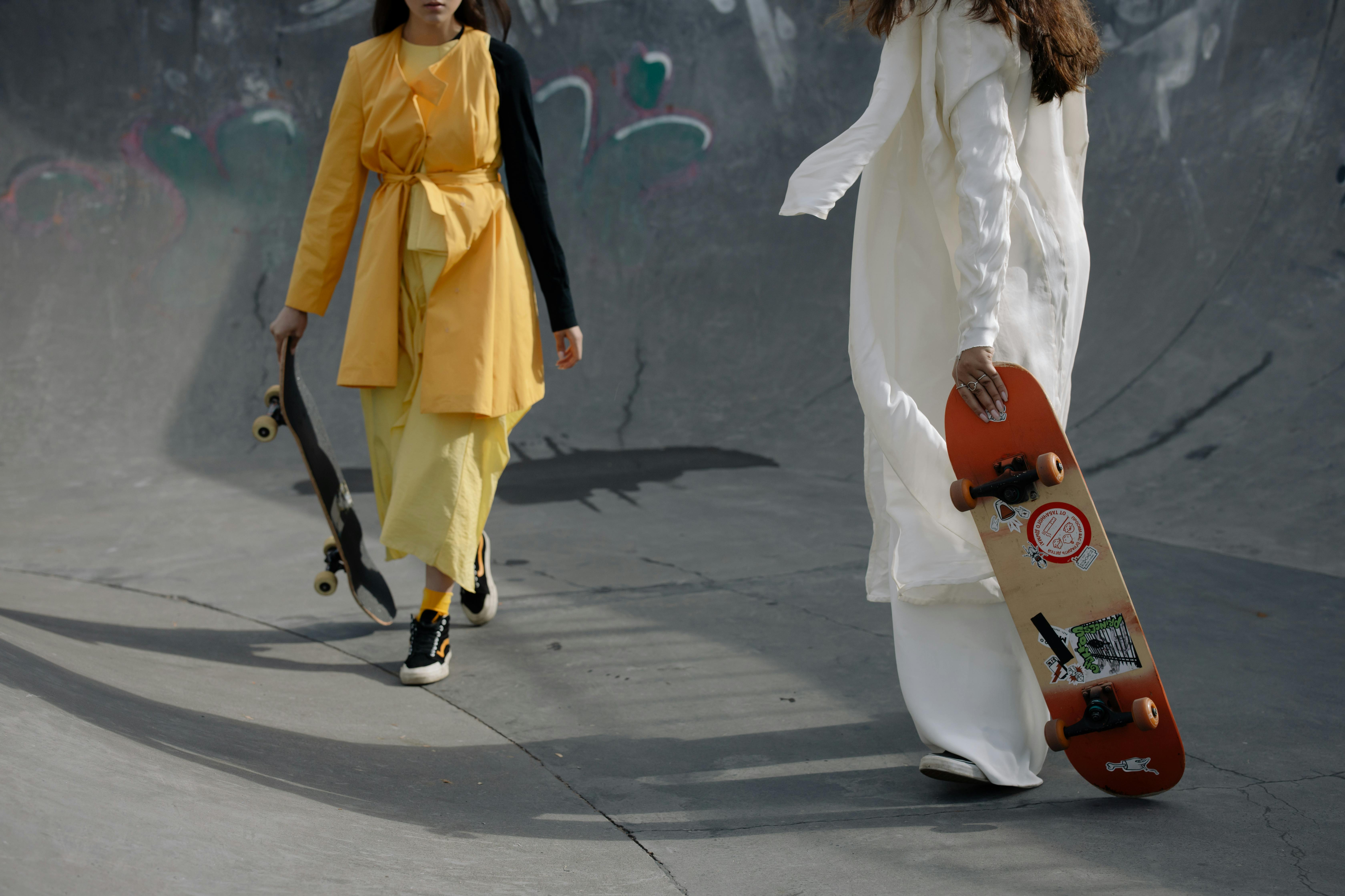 Woman in Yellow Clothes Skateboarding · Free Stock Photo