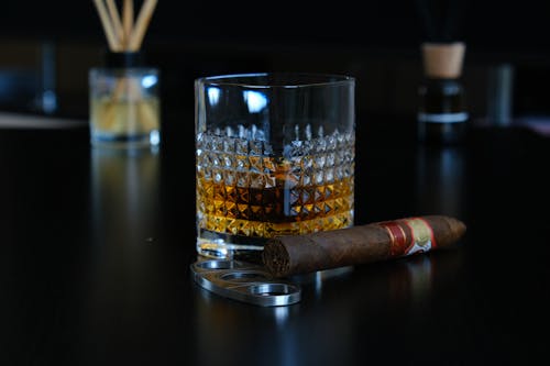 Tobacco Beside a Glass of Alcoholic Beverage