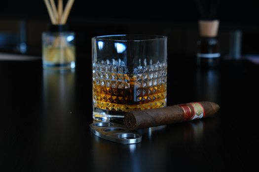 Tobacco Beside a Glass of Alcoholic Beverage