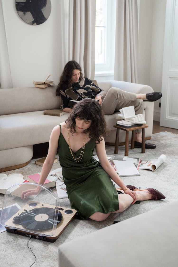 Woman On Floor With Vinyl Recorder And Man On Bed