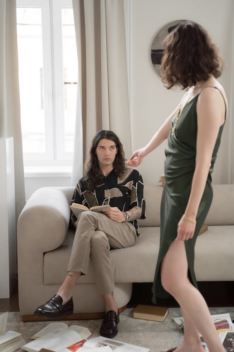 Woman Inviting Man To Dance In Room