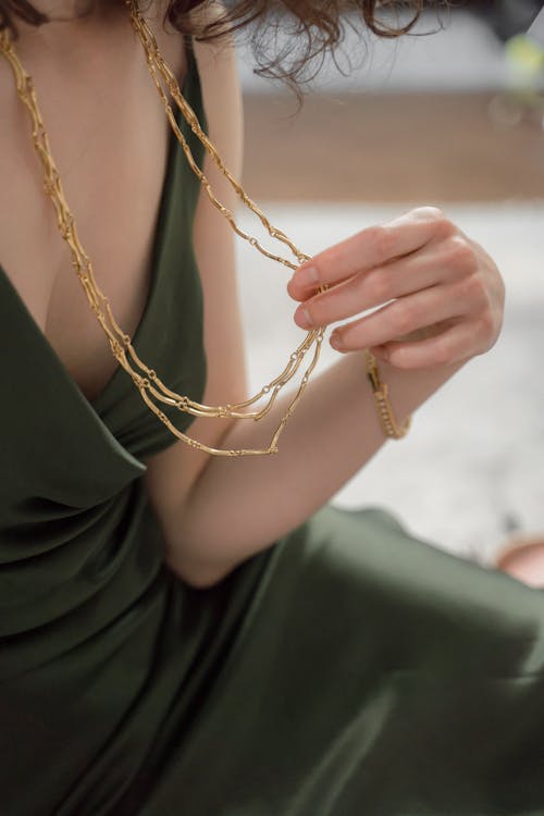 Free Close up on Womans Golden Necklace Stock Photo