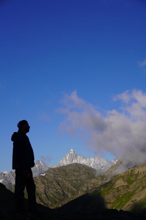 Silhouette of a Man in the Mountains