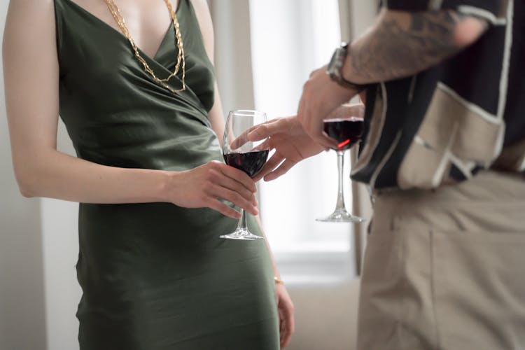 Man Giving Wine Glass To Woman