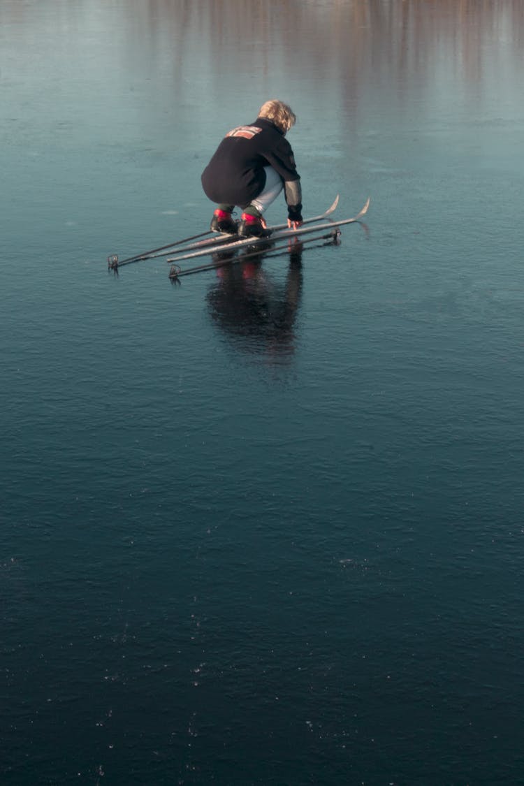 Person On Ski On A Frozen Lake